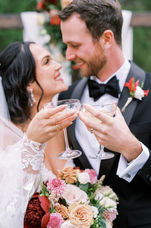 Bride and Groom toasting with coupes 
