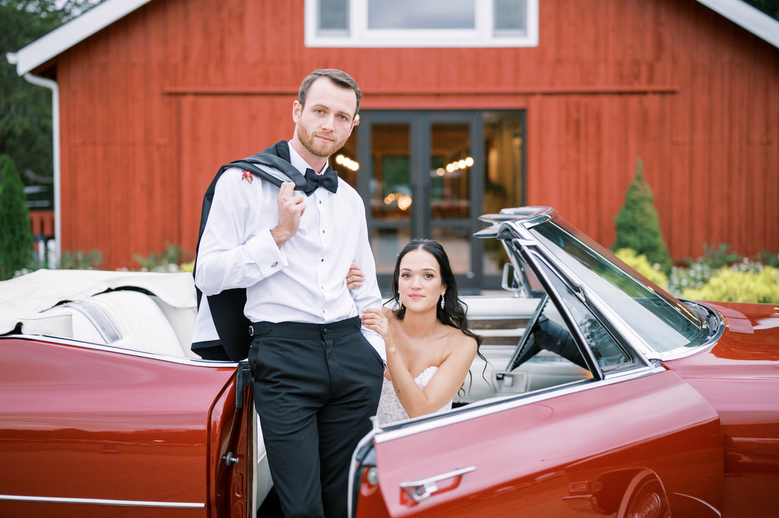 bride and groom at nashville barn wedding in a  vintage car exit