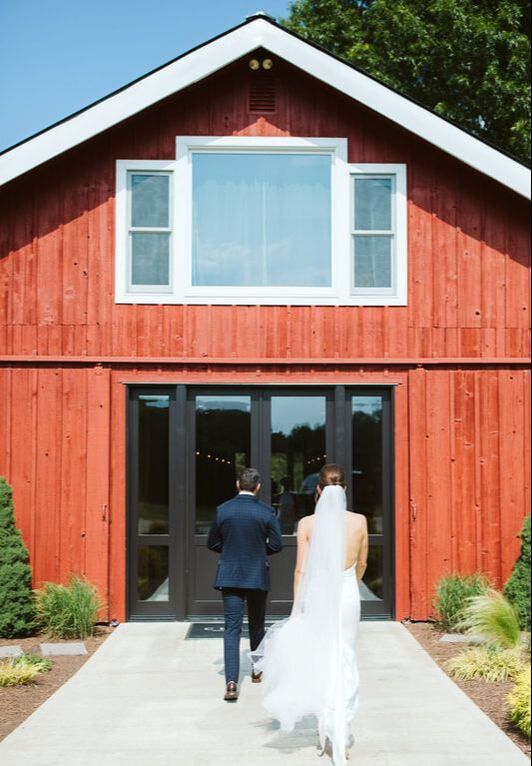 couples first dance inside reception barn